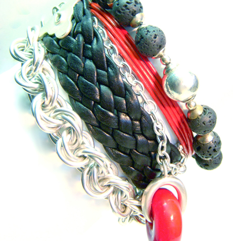 4) Murano glass donut (Venice) between lava rocks, braided leather and a sterling silver necklace.